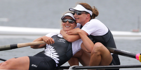 Rebecca Scown and Juliette Haigh celebrate after crossing the line in the women's pairs final. Photo / Brett Phibbs
