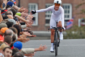 New Zealand's Linda Villumsen is applauded by the crowds after finishing fourth in the women's time trial event. Source / Mark Mitchell NZ Herald