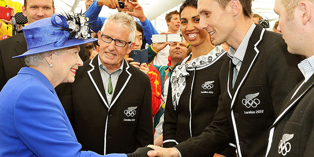 Queen Elizabeth II meets Kiwi athlete Nick Willis and other members of the New Zealand Olympic team as she tours the Athletes Village dining hall at Olympic Park in London. Photo / AP