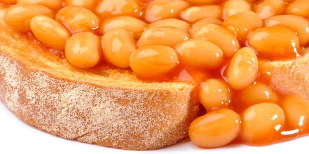 Biting into warm, crispy toast generously topped with baked beans: the perfect way to fuel up. Photo / Thinkstock