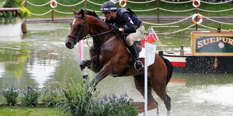 Mark Todd riding Campino leaps over the last of the water jumps during the individual eventing cross country. Photo / Mark Mitchell