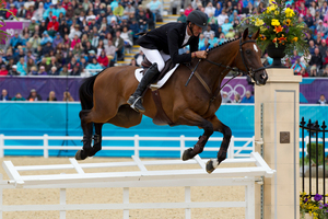 Mark Todd knocks a rail off during his Show Jumping in the Equestrian Eventing. Photo / Brett Phibbs