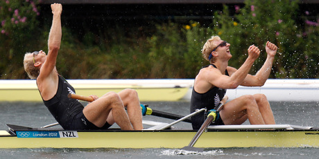 Eric Murray, left, and Hamish Bond celebrate as they cross the line to claim Olympic gold in the men's pair rowing final at Eton Dorney. Photo / Mark Mitchell