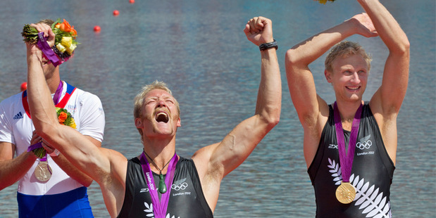 Eric Murray and Hamish Bond celebrate after the medal ceremony. Photo / Brett Phibbs