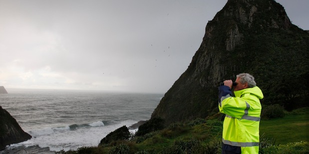 Three climbers are missing after falling in the sea at New Plymouth's Paritutu Rock today (centre). Photo / Rob Tucker
