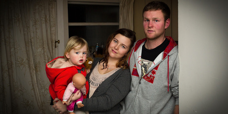 Kim and Isaac Allison with 2-year-old Alice, say their home is cold and damp.
Photo / Martin Hunter