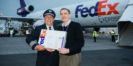 Captain Bear Kramer delivering the first package to Kim Garner, Managing Director FedEx Express Australasia. Photo / Supplied