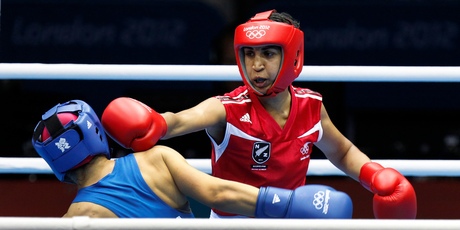 Aucklander Alexis Pritchard battles Sofya Ochigava of Russia in the lightweight boxing before being beaten comprehensively. Photo / Mark Mitchell