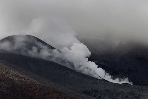 A night of drama and tears as steam billows from Mt Tongariro. Photo / Alan Gibson