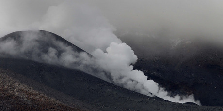 Steam bellows from vents at the summit of Mt Tongariro this morning which is visible for the first time since Monday nights eruption of the central North Island volcano. Photo / Alan Gibson