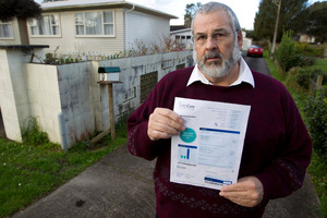 Gary Osborne of Henderson with his property's water bill. Photo / Steven McNicholl