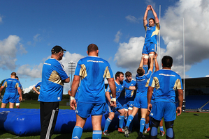 Kieran Read is lifted during lineout drills by the All Blacks at Trusts Stadium yesterday. Picture / Getty Images