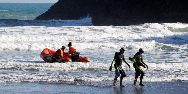 The search for the three missing people continued yesterday. Photo / Christine Cornege