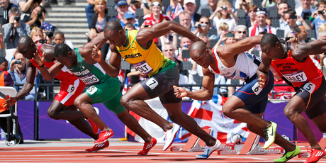 Jamaica's Usain Bolt (wearing yellow) in a 100m heat at the Olympics. Photo / AP