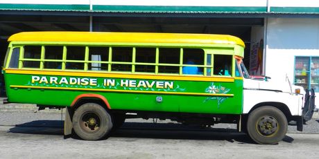 One of the many brightly painted buses of Samoa. Photo / Dan Ahwa