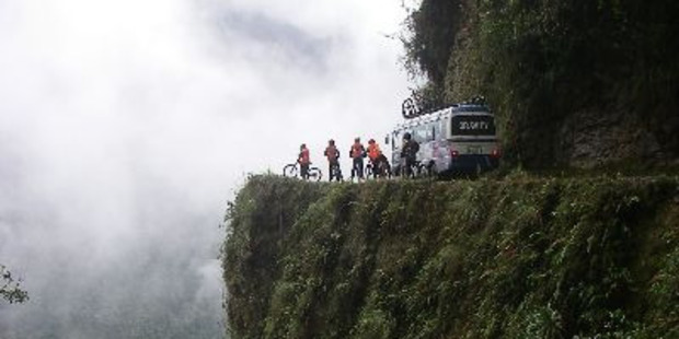 The bike tour takes you through the challenging Death Road where you encounter blind corners and 'murder muffin' rocks. Photo / www.gravitybolivia.com