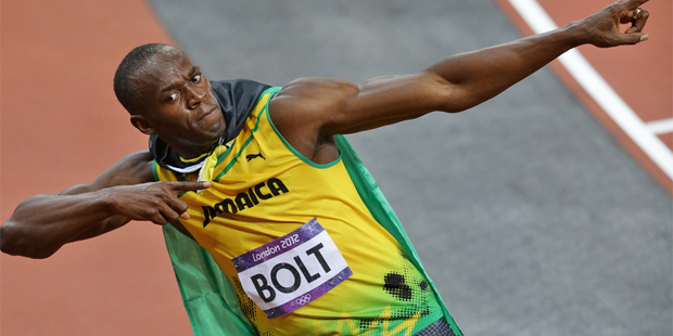 Usain Bolt does his trademark celebration after winning gold in the men's 100m final. Photo / Brett Phibbs
