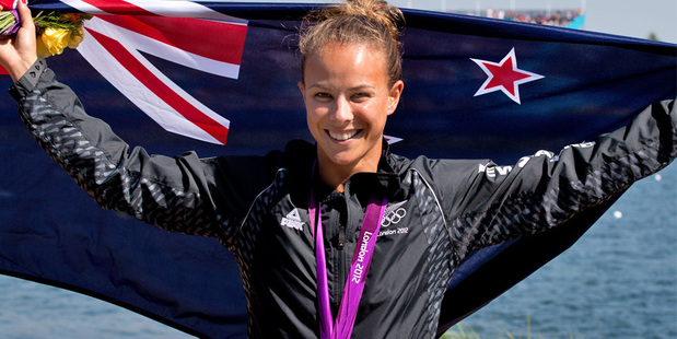 New Zealand kayaker Lisa Carrington celebrates after winning the gold medal in the final of the women's 200-metre K-1 canoe sprint. Photo / Brett Phibbs NZ Herald