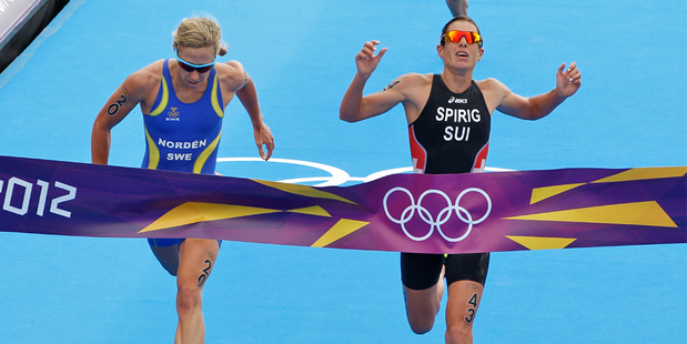 Switzerland's Nicola Spirig, right, just beats Sweden's Lisa Norden to the finish line in the Olympic Games Women's triathlon at Hyde Park. Photo / Mark Mitchell