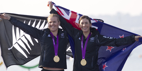 New Zealand's Jo Aleh, left, and Olivia Powrie jubilant after receiving the gold medal for the Olympic Games women's 470. Photo / Mark Mitchell