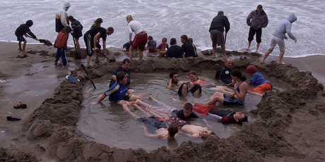 Take a spade to the Coromandel's Hot Water Beach and dig your own hot pool. Photo / Greg Bowker