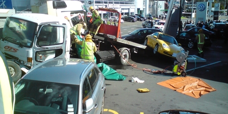 A multi-vehicle crash in Newmarket today saw a truck plough into a Porsche dealership. Photo / Steven Grozev.