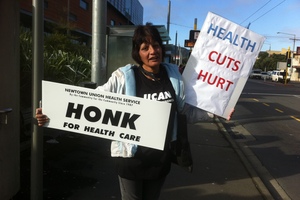 A protester outside Wellington Hospital today. Photo / APNZ