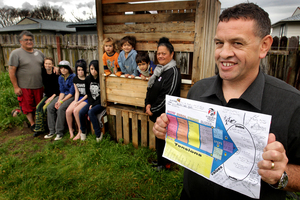 Whanau Ora worker Dean James (front), with (from left) Steve Smith, Mirinoa Smith, Steel Ringiao, 15, Darcee Smith, 14, Teia Smith, 16, Mosiah Smith, 2, Randall Smith, 6, Amergin Smith, 4, and Whanau Ora worker Ann Kururangi. Photo / Alan Gibson
