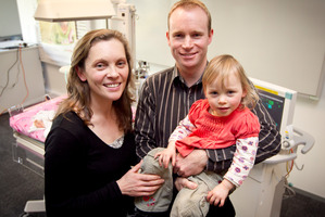 Catherine and Geoff Bold and 2-year-old Sophie revisit the monitoring equipment at Middlemore Hospital that helped keep the underweight newborn alive. Photo / Natalie Slade
