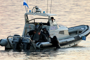 Divers search for a missing boatie in Wellington Harbour . Photo / Herald on Sunday / Hagen Hopkins