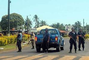 Armed police outside the airport at Faleolo. Photo / Supplied