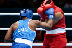 Mohammed Arjaoui of Morocco competes against Blaise Yepmou Mendouo of Cameroon. Photo / AP