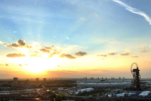 The sun sets behind the Olympic stadium before the Closing Ceremony of the 2012 Summer Olympics. Photo / AP