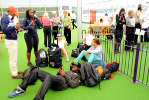 US sprinter Justin Gatlin relaxes as he waits to depart at the Games Terminal at Heathrow Airport. Photo / AP
