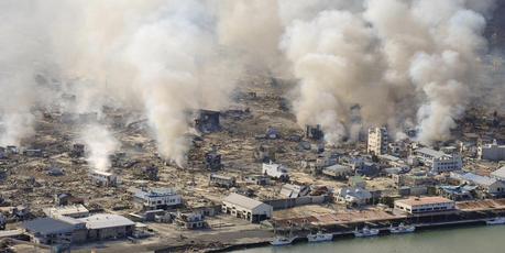This March 12, 2011 file photo shows smokes rising from burning homes in Yamadamachi in Iwate Prefecture, northern Japan a day after a strong earthquake triggered a devastating tsunami. Photo / AP