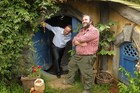 Prime Minister John Key is shown the interior of a "hobbit house" by film director, Sir Peter Jackson. Photo / Alan Gibson.