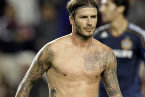 David Beckham's tattoos represent his children, special dates and the number on his football shirt.
Photo / AP