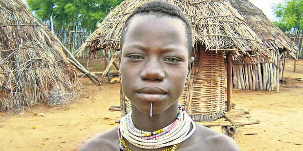 A Karo girl shows off the long nail protruding through her lower lip, which seems to be the standard adornment for females in Ethiopia. Photo / Vicki Virtue