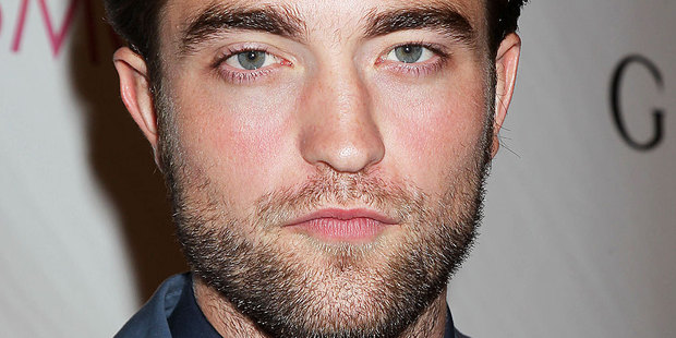 Robert Pattinson evaded questions about his girlfriend's affair during an interview on Good Morning America. Photo / AP