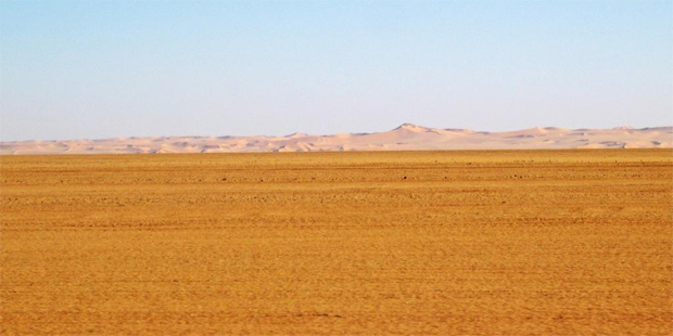Libya's vast, desolate surroundings hide the remains of an ancient ocean of stone. Photo / Jill Worrall