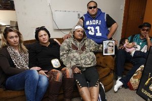 Members of the Dunn whanau, including occupants James, second from right and Raymond Dunn, right, in the Otangarei home. Photo / Northern Advocate