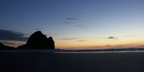 Piha after sunset. Photo / Wikimedia Commons