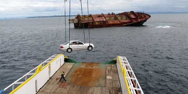 The Mercedes C200 Kompressor being recovered from the Rena. Photo / APN