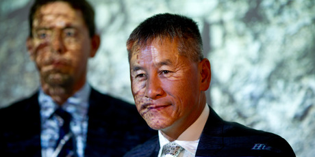 Outgoing Fletcher Building CEO Jonathan Ling, with new boss Mark Adamson standing behind him, says job cuts are on the cards in Australia. Photo / Dean Purcell