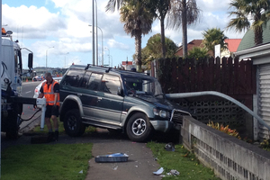 The scene of the crash which killed a woman after the car she was in collided with a police car. Photo / NZ Herald