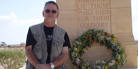 Garrie Hutchinson at the Tobruk War Cemetery in Libya, where 38 New Zealanders are buried. Photo / Supplied