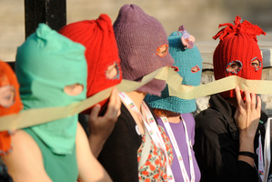 Supporters of the Russian punk group Pussy Riot walk through downtown Warsaw, Poland. Photo / AP