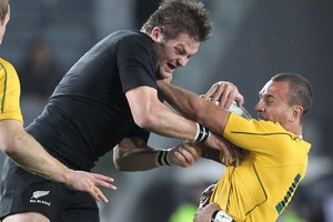 Richie McCaw and Quade Cooper are set to renew their rivalry tonight at Eden Park. Photo / Paul Estcourt