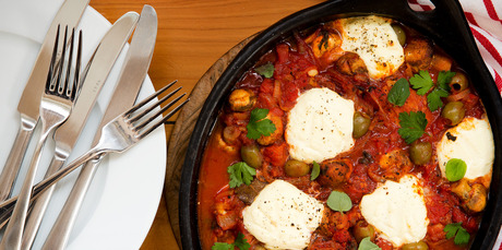 Chicken baked with olives, ricotta and mushrooms. Photo / Babiche Martens