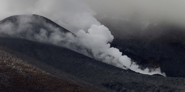 Steam billows from vents at the summit of Mt Tongariro. Photo / Alan Gibson